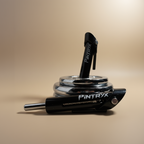 Black Pintryx drop set pins in middle of weight plate on beige background.