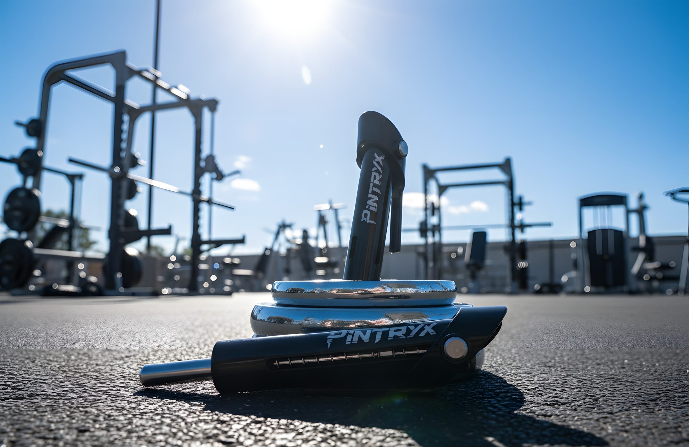 Pintryx black drop set pins on the ground of an outside gym.