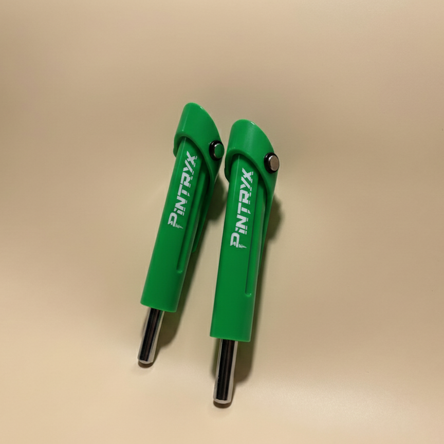 Green Pintryx drop set pins standing straight up on beige background.