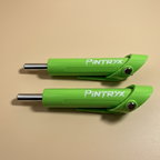 Green Pintryx drop set pins laying flat on beige background.