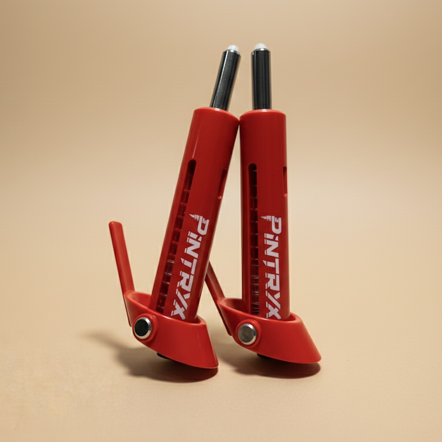 Red Pintryx drop set pins upside down on beige background.