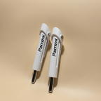 White Pintryx drop set pins standing straight up on beige background.