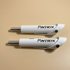 White Pintryx drop set pins laying flat on beige background.