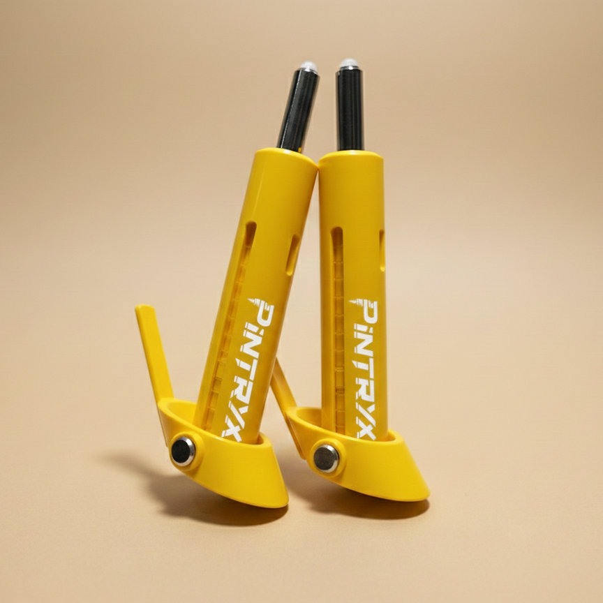 Yellow Pintryx drop set pins upside down on beige background.